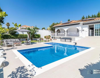 Modern villa with pool & BBQ next to a beach